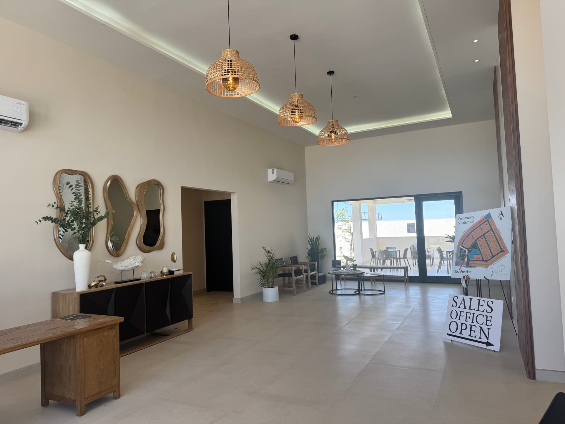 Viviente clubhouse lobby with rattan pendant lights